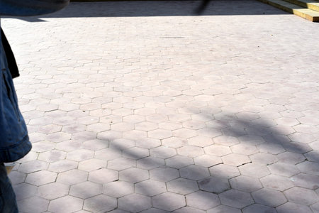 Perspective view of paving slabs in the park with shadow