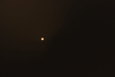 Moon in the sky at night. The moon is half moon.