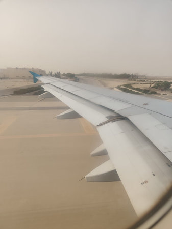 View of airplane wing in the fog, Airplane window view.の写真素材