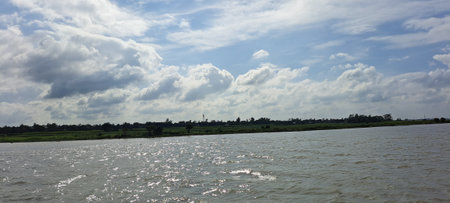 Landscape view of river and sky with white clouds, Thailand.の写真素材