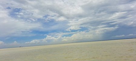 Panoramic view of the sea and cloudy sky on a sunny dayの写真素材