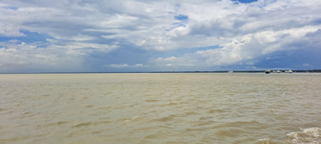 Panoramic view of the sea and blue sky with white cloudsの写真素材