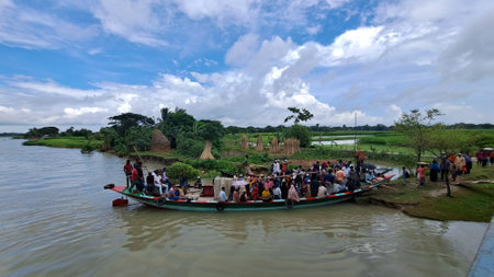 Unidentified people on a boat in Bengaluru, Karnataka, Indiaの写真素材
