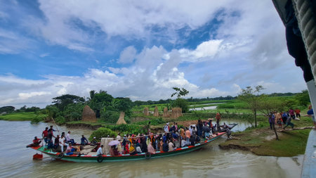 Unidentified Thai people are traveling by boat in Kanchanaburi, Thailand.の写真素材