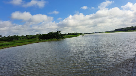 Landscape view of the river with clouds in the blue sky.の写真素材