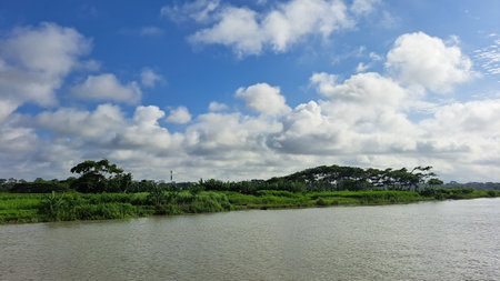 River and blue sky with white clouds in the countryside of Thailand.の写真素材