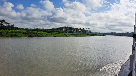 Landscape view of river and blue sky with white clouds on sunny dayの写真素材