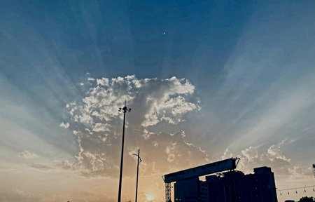 sunset in the city, clouds in the blue sky and roadの写真素材