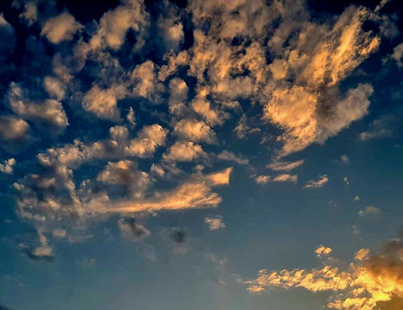 beautiful clouds in the sky at sunset, closeup of photoの写真素材