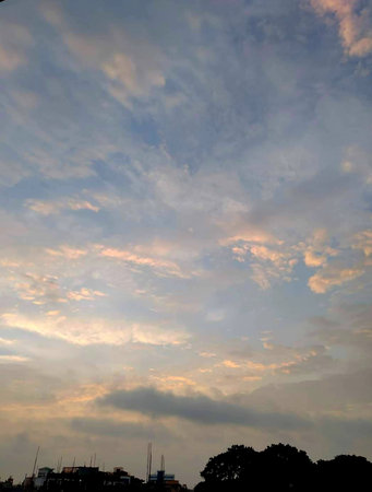 Cloudscape, Colored Clouds at Sunset near the Ocean on a Cloudy Day
