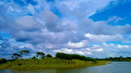 Beautiful landscape with blue sky and white clouds over the lake.の写真素材