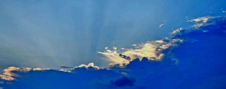 Panorama of blue sky with clouds and sun. Nature background.の写真素材