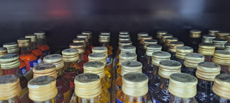 Coffee beans in plastic bottles on shelf of coffee shop.の写真素材
