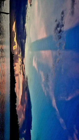 Reflection of the sky and clouds in the water. Abstract background