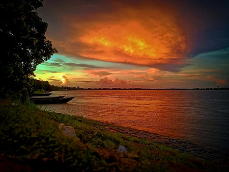 Sunset on the river in the tropics. Colorful sky.