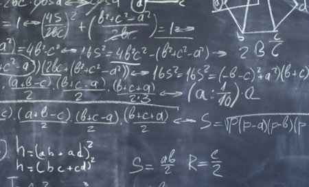 Mathematical formulas written on a blackboard. Education concept.