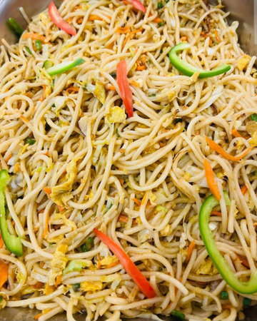 Fried noodle with vegetables in a pan. Selective focus.の写真素材