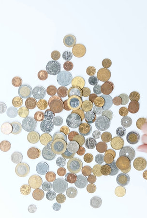 Coins of different countries on a white background. Financial concept.