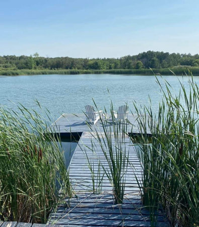 Wooden jetty on a lake in the summer, Poland.の写真素材