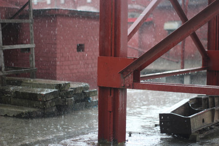 Red structure under heavy rain.の写真素材