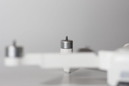 a close up of detailed white drone parts isolated on white background. drone camera photo concept.