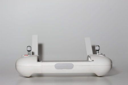 a close up of detailed white drone remote parts isolated on white background. drone camera photo...