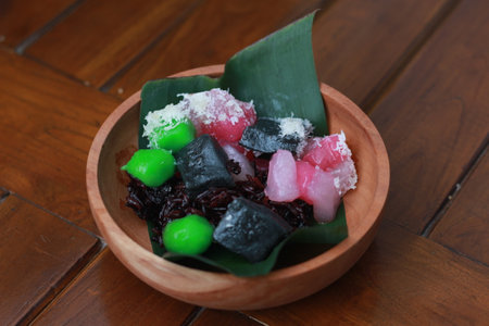 a close up of a traditional Indonesian food called Cenil. has a bright color and chewy texture with the addition of grated coconut and sugar. Indonesian traditional food photo concept.の写真素材