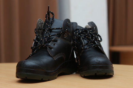 Detailed photo of a pair of safety shoes for work. Work protective equipment concept photo.の写真素材