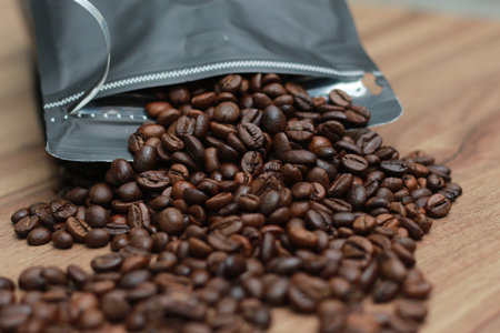 Detailed photo of coffee beans before being processed into a drink isolated on wood. Concept photo...