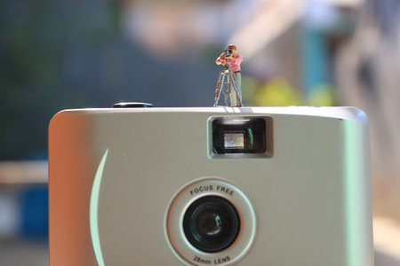 miniature figure of a videographer recording on an analog camera.の写真素材