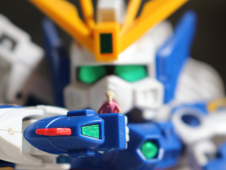 a miniature figure of a girl holding the robot's hand and looking at each other.の写真素材