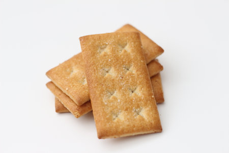 a close up of coconut biscuit with sprinkled sugar isolated on white background.の写真素材