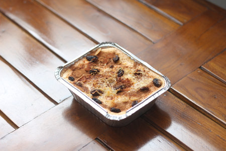 a close up of klapertart which is a typical food from Manado, Indonesia. Made from young coconut meat, sugar, flour, almonds, milk, butter, eggs, cinnamon and grated cheese. Indonesian traditional food photo concept.の写真素材