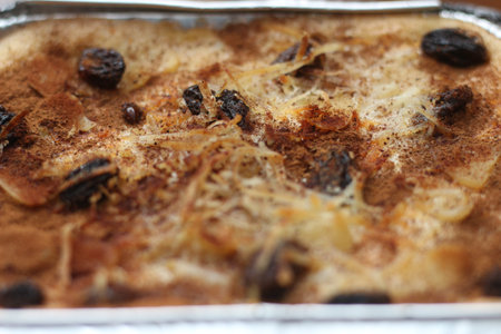 a close up of klapertart which is a typical food from Manado, Indonesia. Made from young coconut meat, sugar, flour, almonds, milk, butter, eggs, cinnamon and grated cheese. Indonesian traditional food photo concept.の写真素材