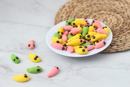 caterpillar cake with various colors. presented during Hari Raya or Eid Al Fitr holiday in...