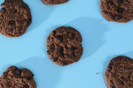 a close up of chocolate cookies isolated on bright background. Food concept photo.の写真素材