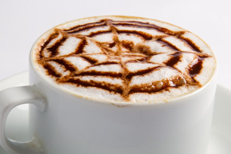 Cappuccino with foam on white background. Close up.の写真素材