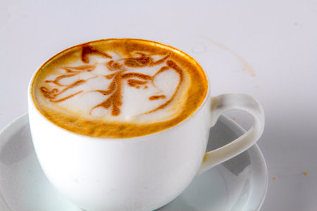 Designer coffee cup on a white background, latte art.の写真素材