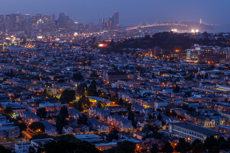 San Francisco cityscape panorama with view of the financial district , neighborhoods and Bay Bridge at nightのeditorial素材