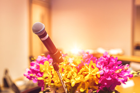 microphone on the stage in the room and flowersの写真素材