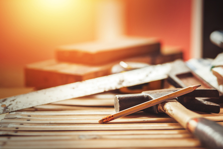 Working tools,hammer and machinist square on wooden.flat lay for construction tools concept.の写真素材