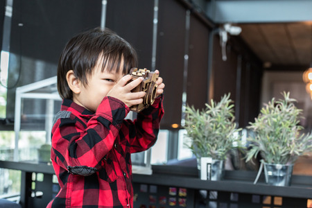 A children play toy in the coffee shop. The wood toy in child hand.の写真素材