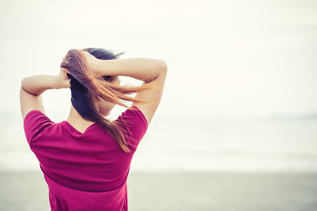 Beautiful women bundle of hair near the beach.の写真素材