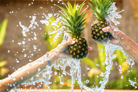 pineapple with water splash.の写真素材
