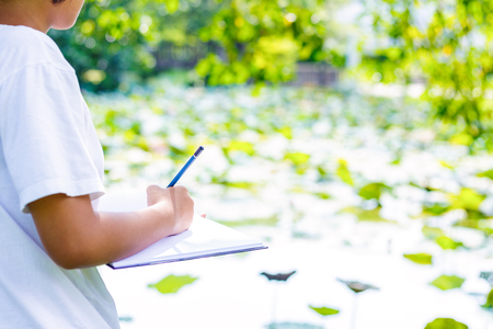 Student practice drawing by pencil in the park.の写真素材
