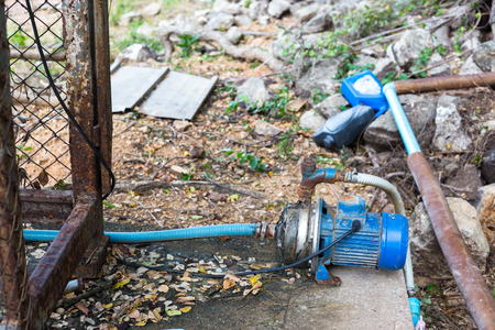 Blue Water pump on the ground.の写真素材