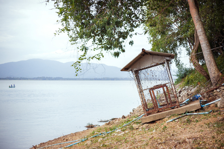 A water pump near the reservoir and mountain is back.の写真素材
