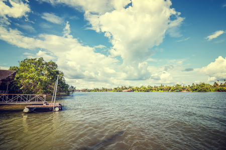The river and cloud with old house and harbor near the river.の写真素材