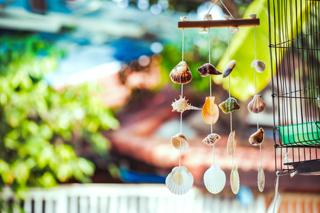 Vintage mobile made from variety seashells. It's hang.の写真素材