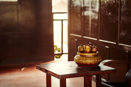 Old cup on the table in the room.の写真素材
